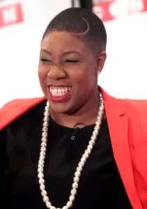 Symone Sanders Smiling with pearl necklace